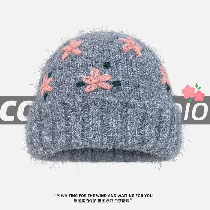 Niche coréenne crocheté à la main fleur tricoté chapeau automne et hiver doux et polyvalent chaud grande tête crâne bonnet casquettes pour les femmes
