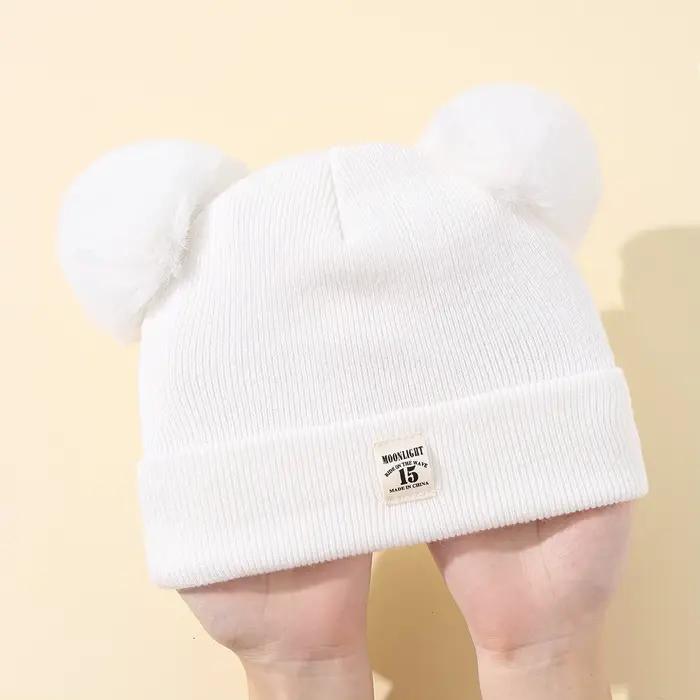 Bonnet tricoté en laine de couleur unie pour nouveau-né