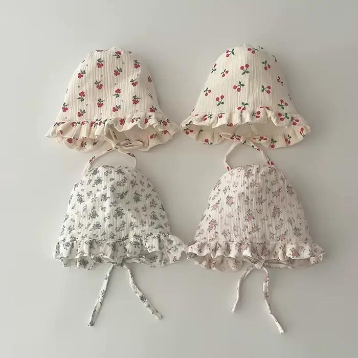 Bonnet floral mignon à volants pour nouveau-né