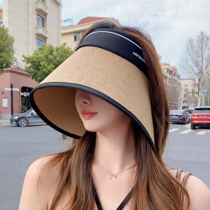 Chapeau de soleil élégant pliable en paille tressée à bord large