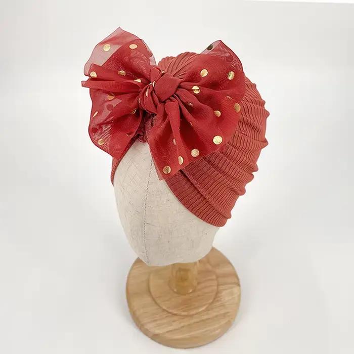 Joli chapeau à nœud papillon brillant pour bébé