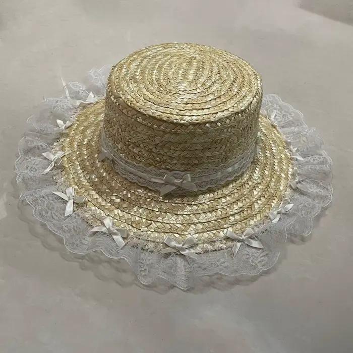 Chapeau de plaisance élégant en dentelle avec nœud plat et large bord pour femmes