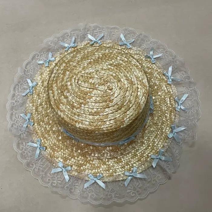 Chapeau de plaisance élégant en dentelle avec nœud plat et large bord pour femmes