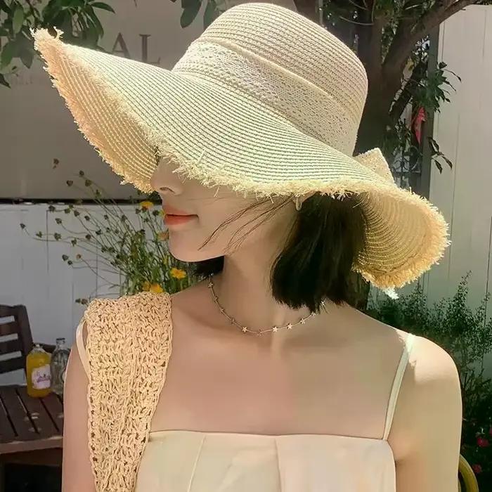 Chapeau de paille pour femme à grand bord avec nœud décoratif