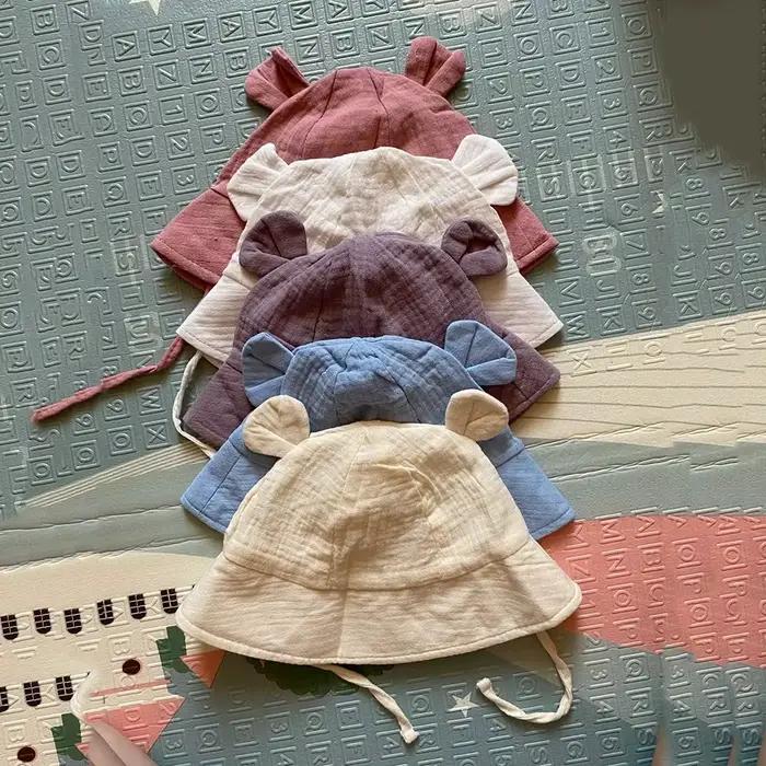 Chapeau en coton mousseline pour bébé