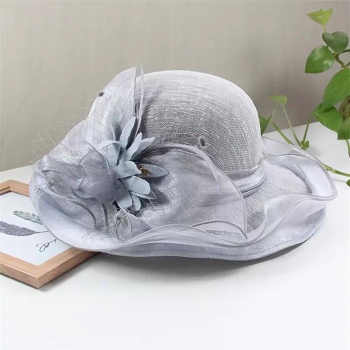 Chapeau de soleil fascinateur Sinamay à grand bord élégant avec fleur
