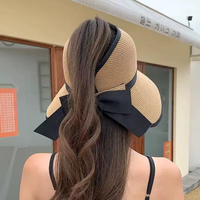 Chapeau de soleil pour femme à visière large en paille