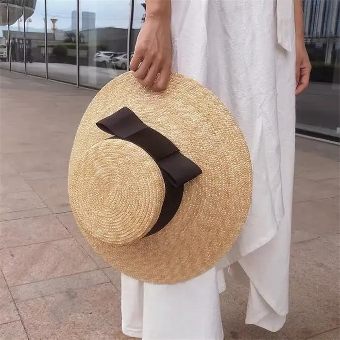202606-nu Nouveauté chapeau de soleil d'été chic en paille tressée à large bord avec grand nœud
