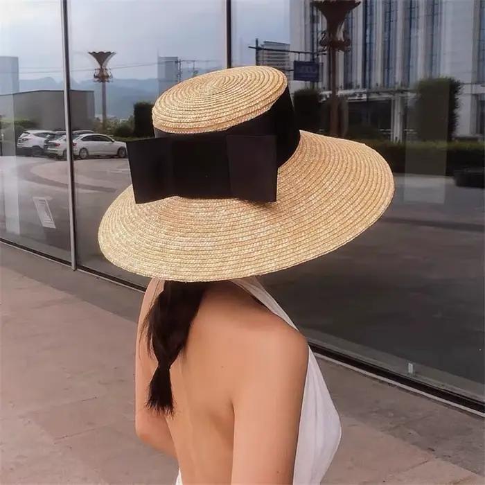 202606-nu Nouveauté chapeau de soleil d'été chic en paille tressée à large bord avec grand nœud